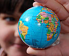 Map of the world in a girl's hand
